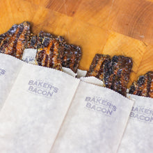 Load image into Gallery viewer, Baker's Bacon on paper packaging on a wooden surface